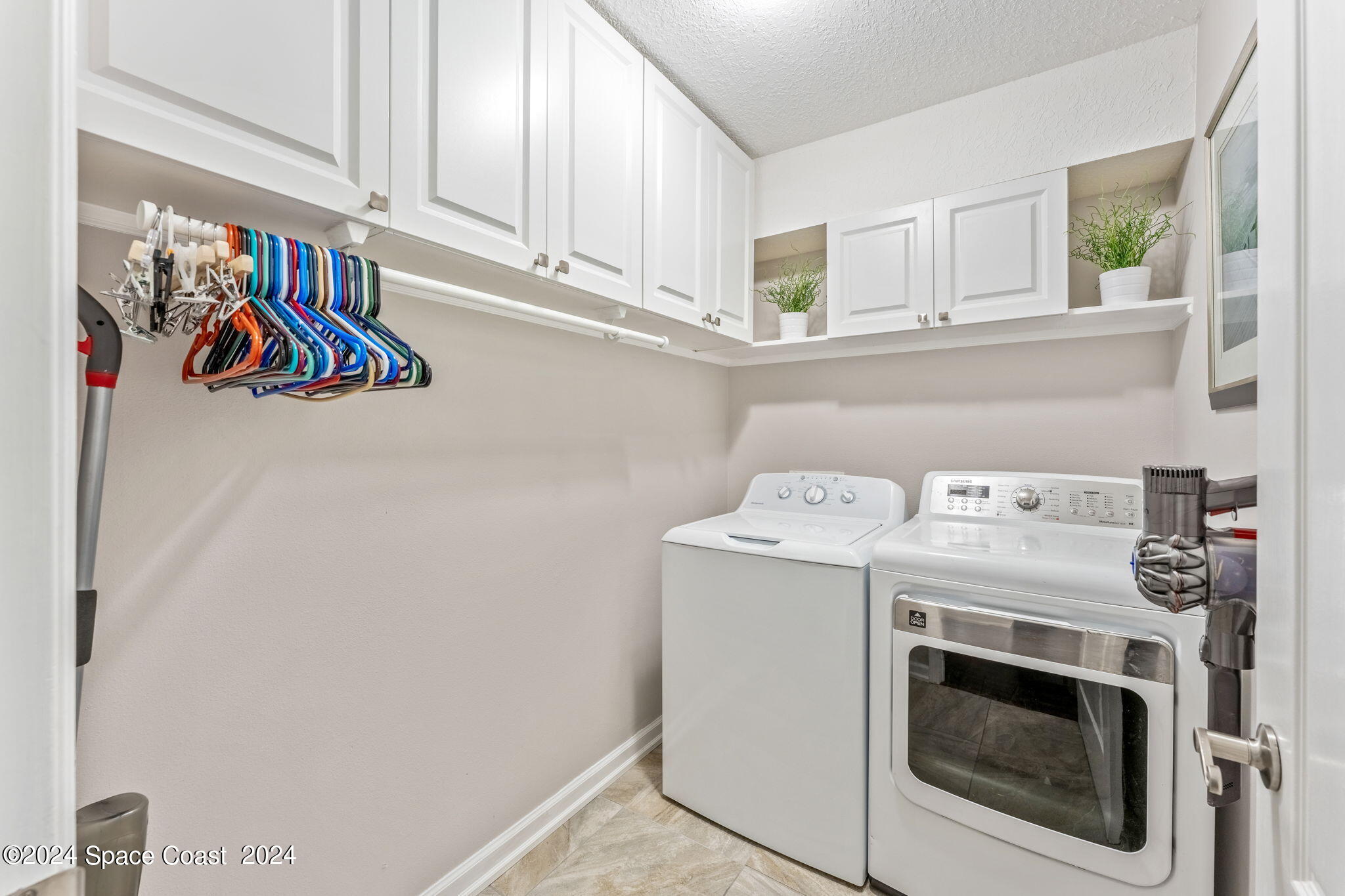 1633 Quinn Drive Rockledge, FL 32955 - Photo 29 of 50 a utility room with dryer and washer