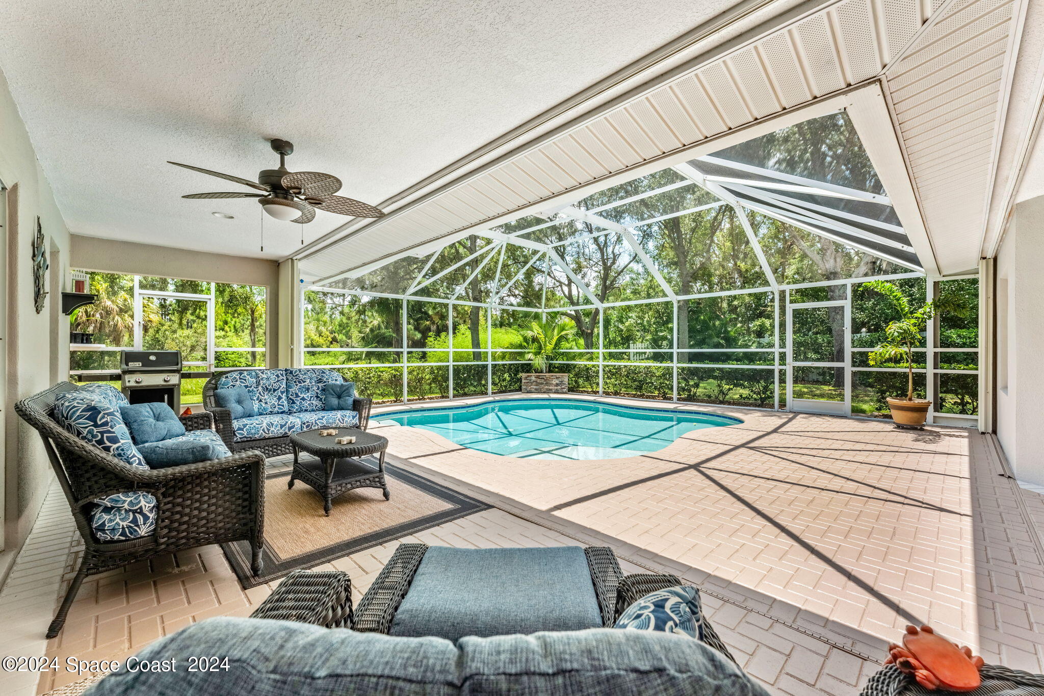 1633 Quinn Drive Rockledge, FL 32955 - Photo 30 of 50 a living room with furniture and a large window