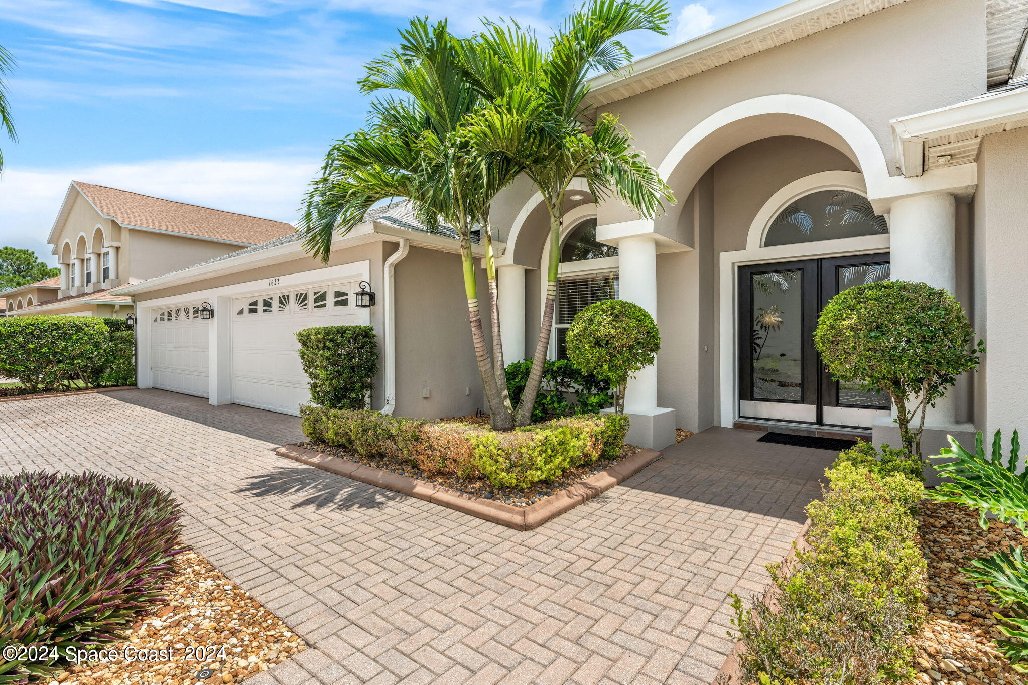 1633 Quinn Drive Rockledge, FL 32955 - Photo 3 of 50 a front view of a house with garden