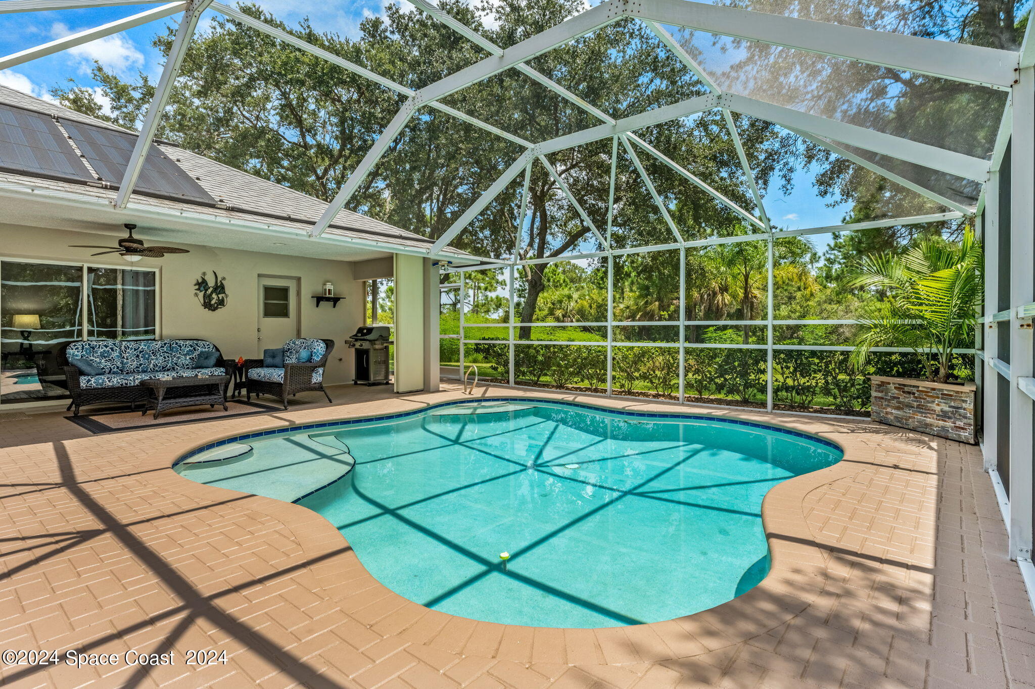 1633 Quinn Drive Rockledge, FL 32955 - Photo 32 of 50 a view of a swimming pool with seating area