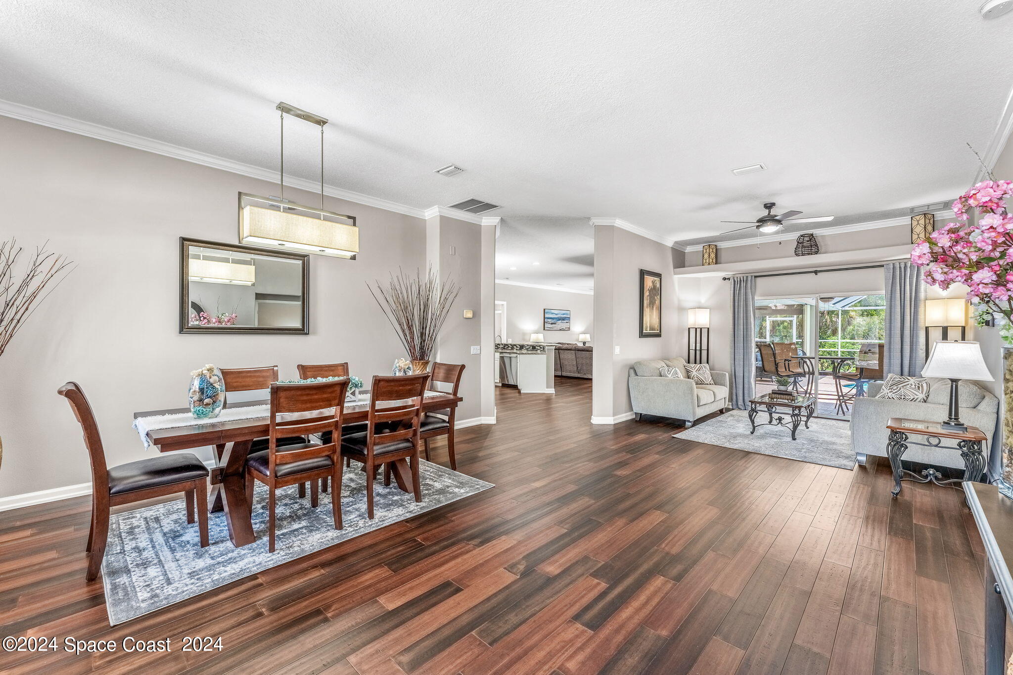 1633 Quinn Drive Rockledge, FL 32955 - Photo 5 of 50 a view of a dining room with furniture window and wooden floor