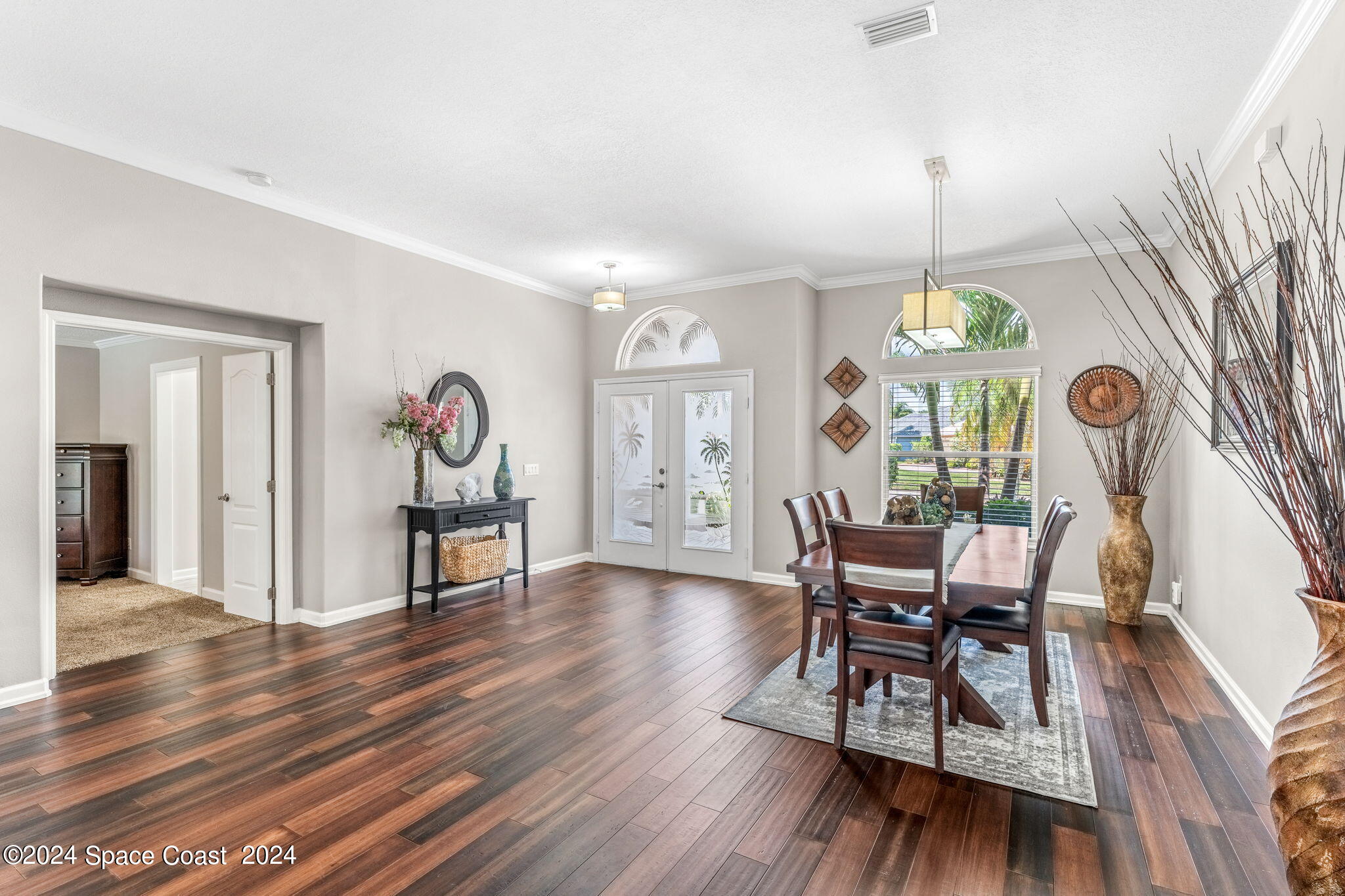 1633 Quinn Drive Rockledge, FL 32955 - Photo 6 of 50 a view of a dining room with furniture and wooden floor