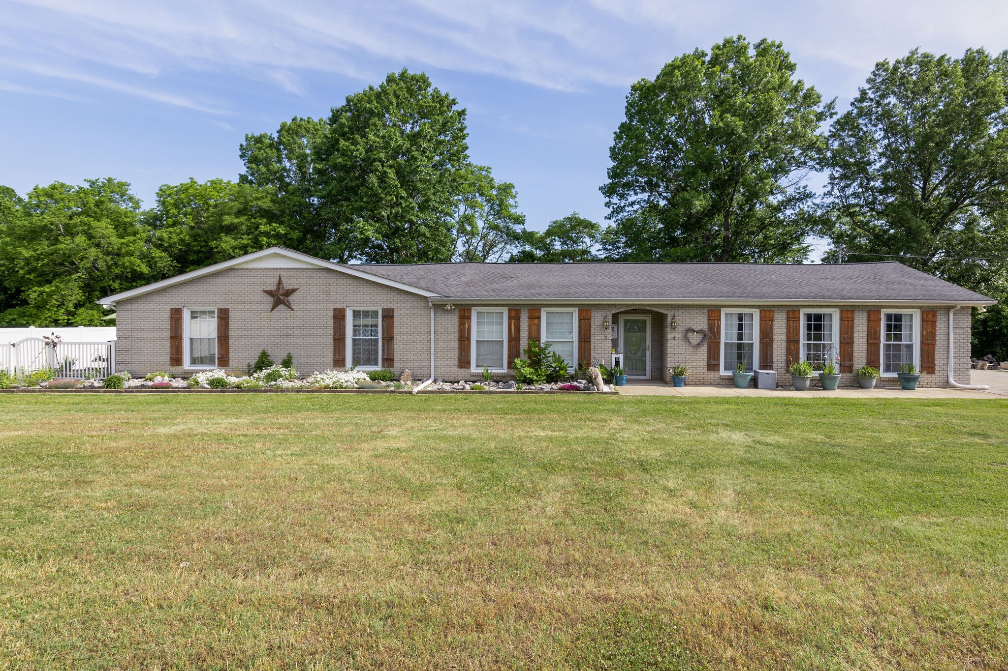 3003 Greens Mill Road Spring Hill, TN 37174 - Photo 1 of 48 a view of a house with a yard and a garden