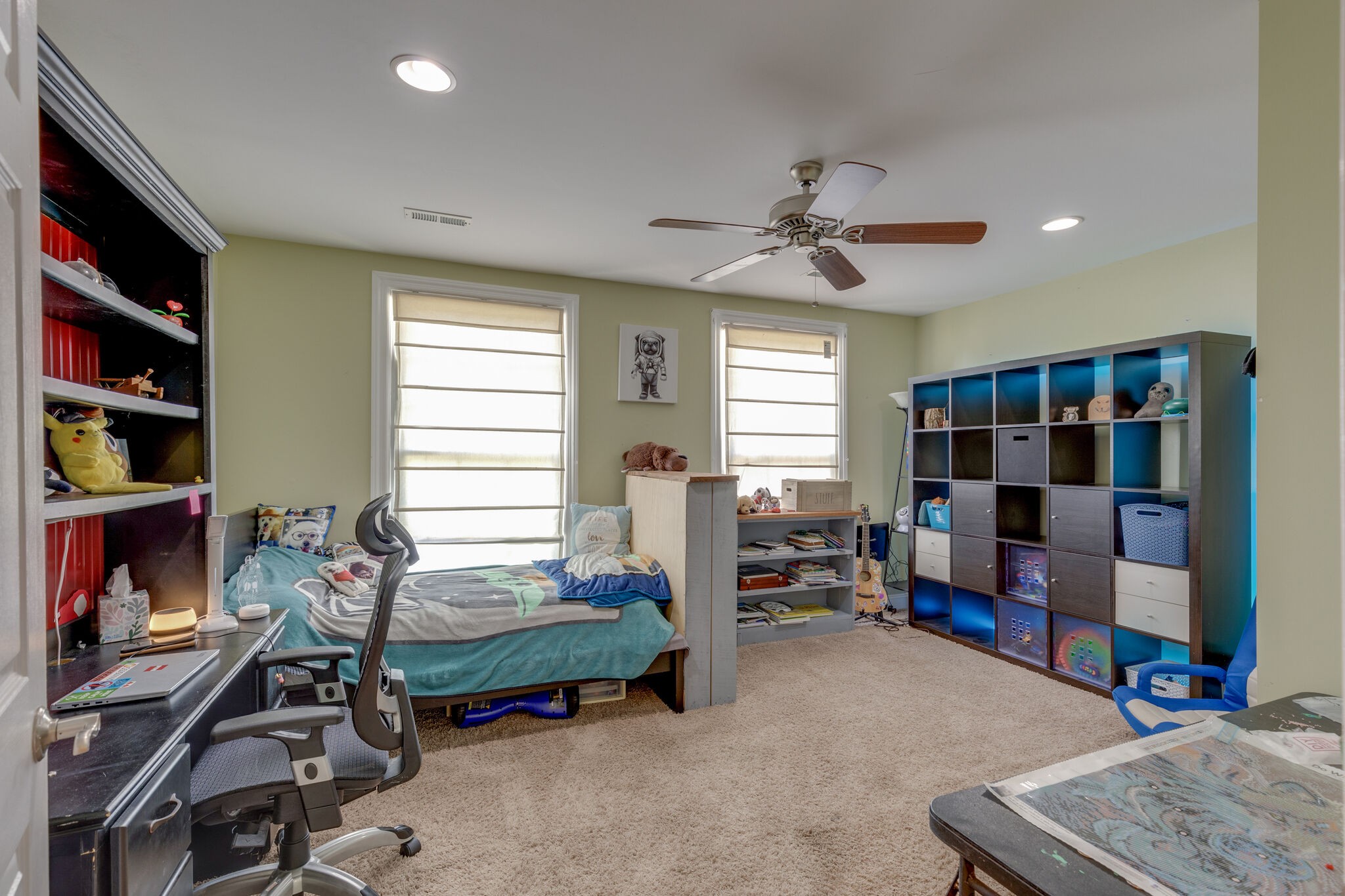 3003 Greens Mill Road Spring Hill, TN 37174 - Photo 16 of 48 a bedroom with furniture and a book shelf