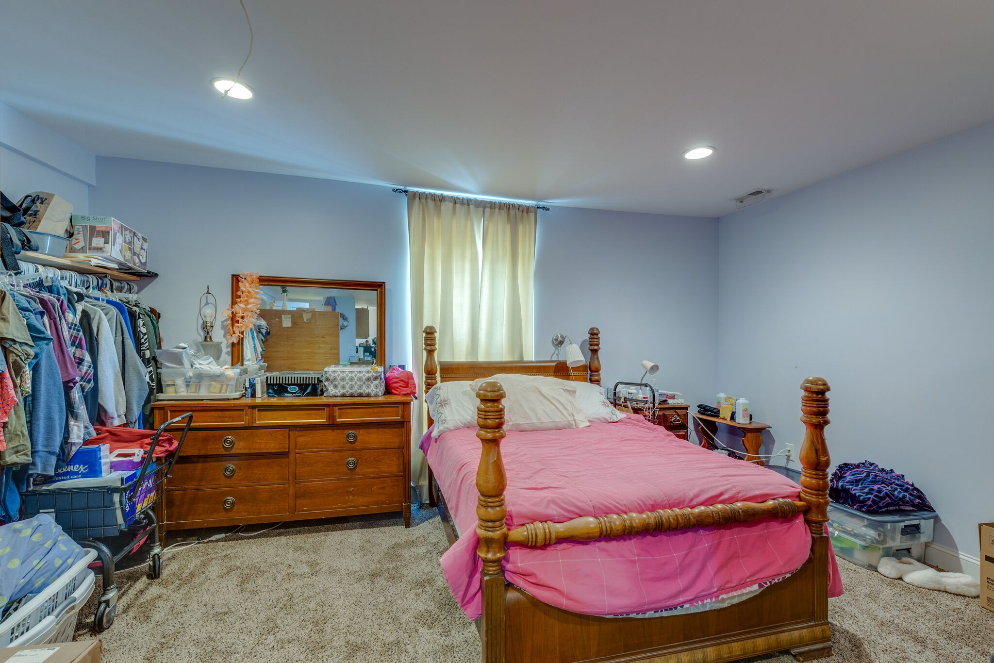 3003 Greens Mill Road Spring Hill, TN 37174 - Photo 25 of 48 a bedroom with a bed and a chandelier