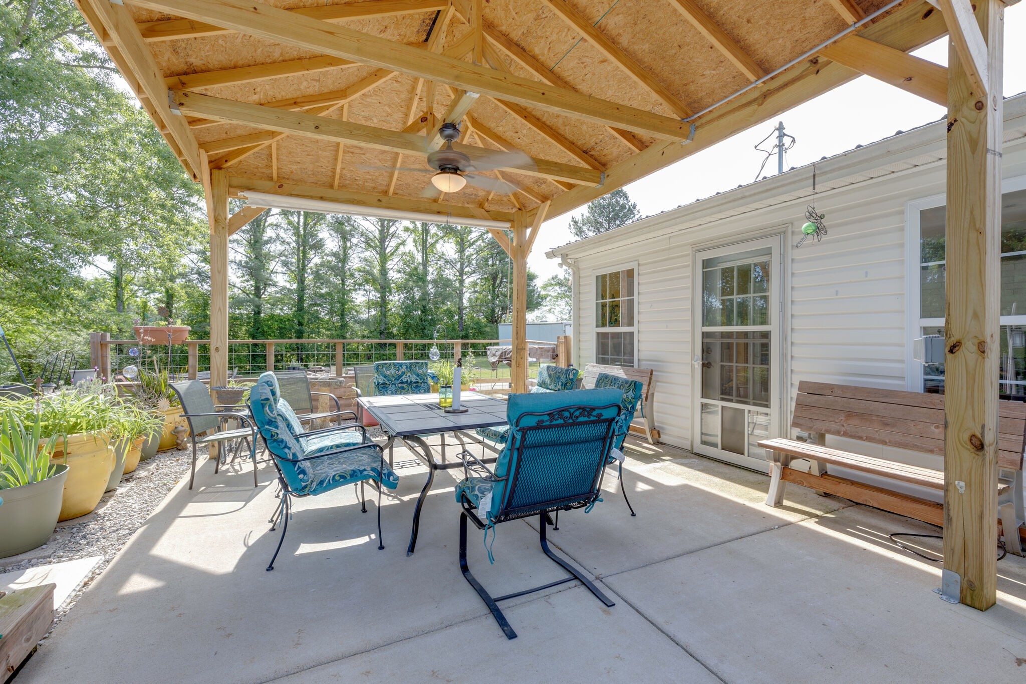 3003 Greens Mill Road Spring Hill, TN 37174 - Photo 30 of 48 a view of a patio with a table chairs and a backyard