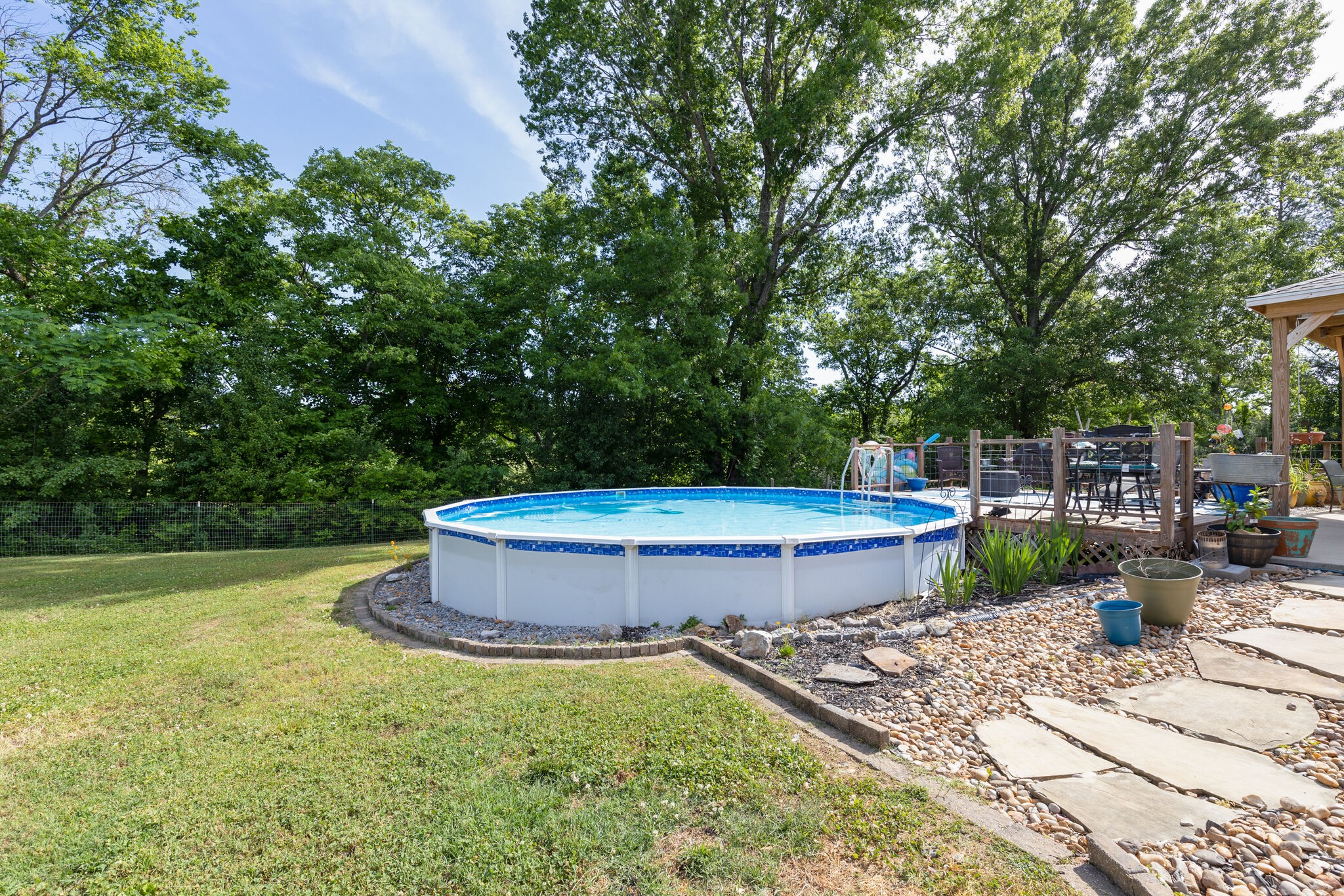 3003 Greens Mill Road Spring Hill, TN 37174 - Photo 33 of 48 a view of a backyard with swimming pool