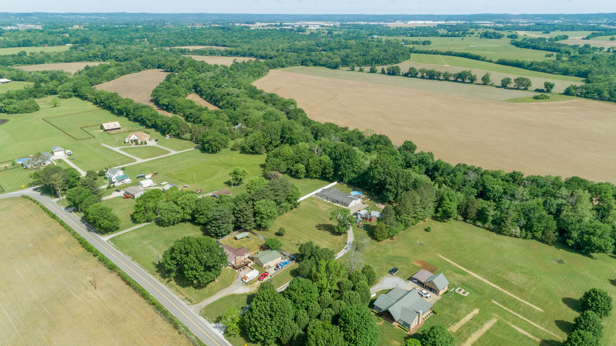 3003 Greens Mill Road Spring Hill, TN 37174 - Photo 38 of 48 an aerial view of a city with lots of residential buildings ocean and mountain view in back