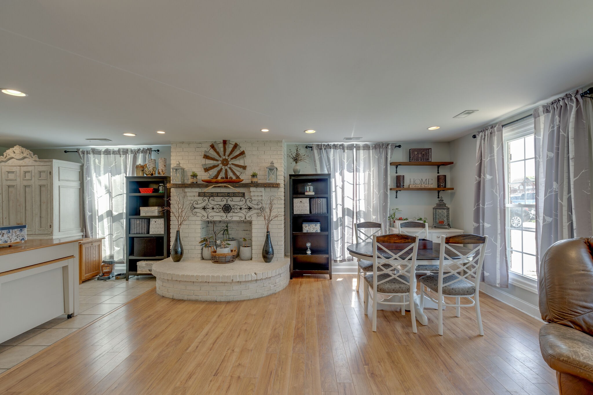 3003 Greens Mill Road Spring Hill, TN 37174 - Photo 4 of 48 a view of a kitchen with dining room and wooden floor