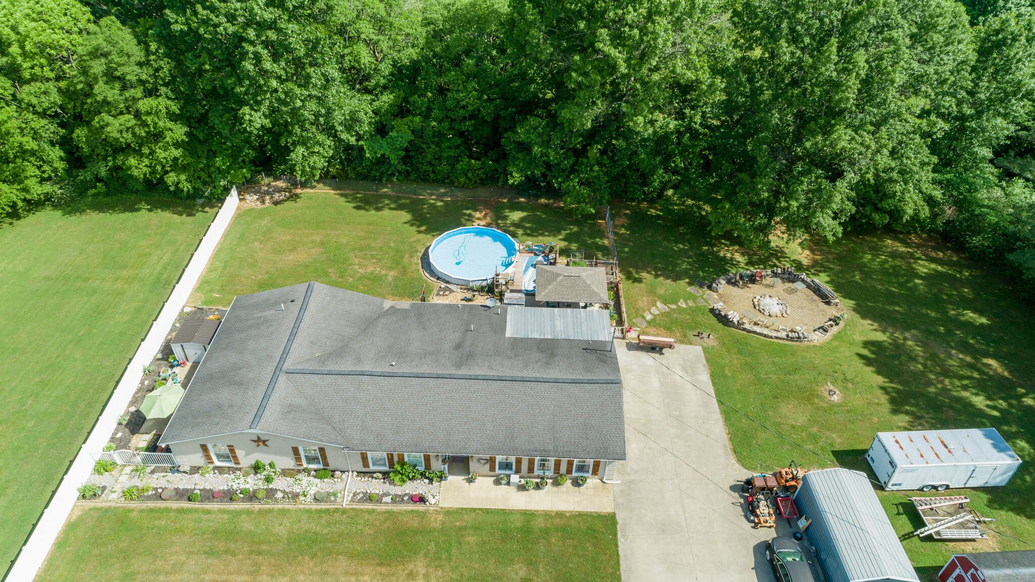 3003 Greens Mill Road Spring Hill, TN 37174 - Photo 45 of 48 swimming pool with a yard and large trees