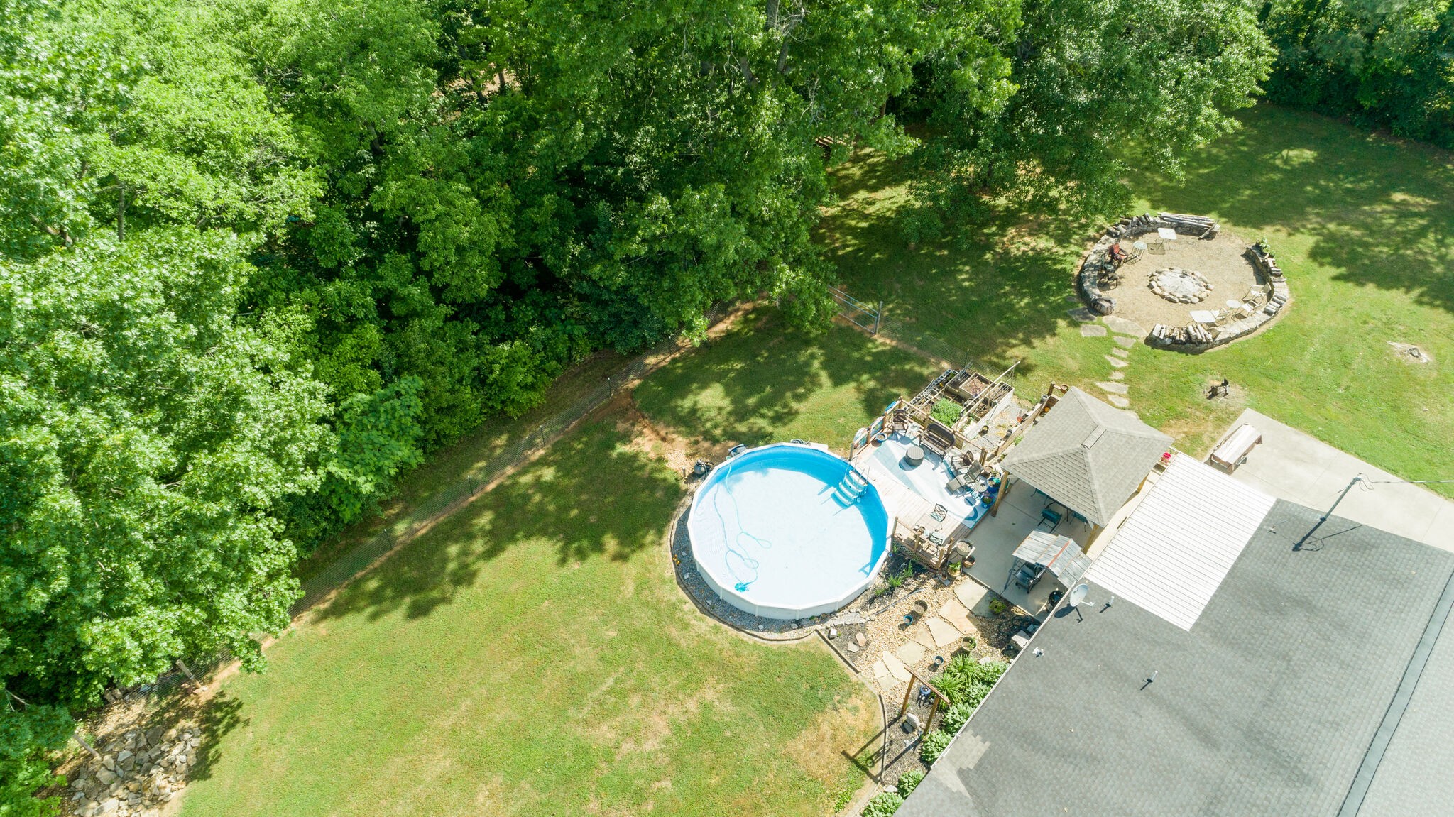 3003 Greens Mill Road Spring Hill, TN 37174 - Photo 48 of 48 a swimming pool with a trees in the background