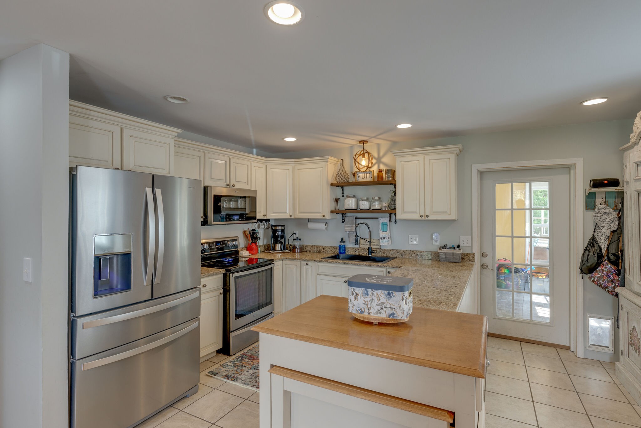 3003 Greens Mill Road Spring Hill, TN 37174 - Photo 6 of 48 a kitchen with refrigerator and cabinets