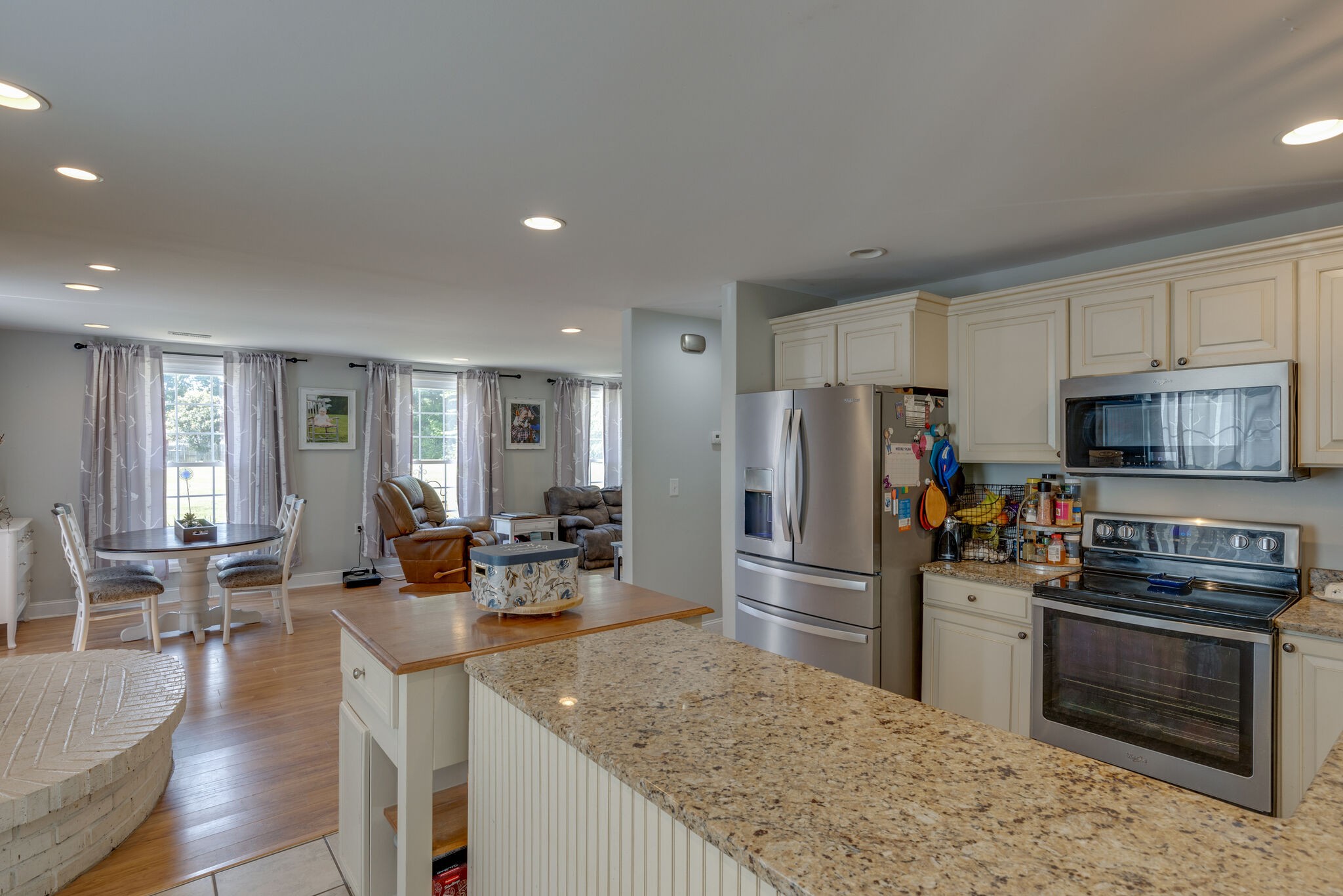 3003 Greens Mill Road Spring Hill, TN 37174 - Photo 7 of 48 a kitchen with stainless steel appliances granite countertop a refrigerator stove microwave and sink