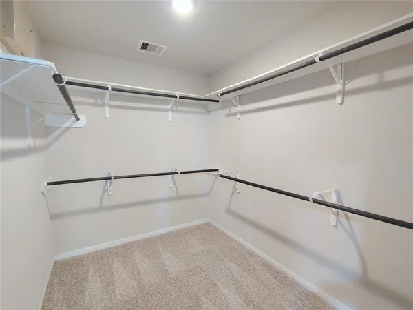 a view of a room with racks on the wall