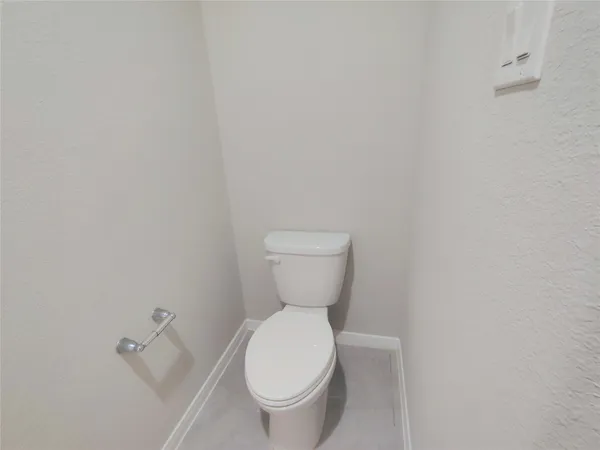 a bathroom with a toilet and a sink