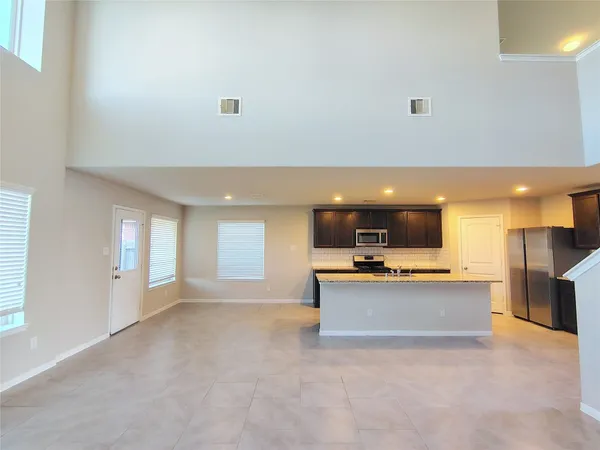 a view of a kitchen with a sink and a stove top oven