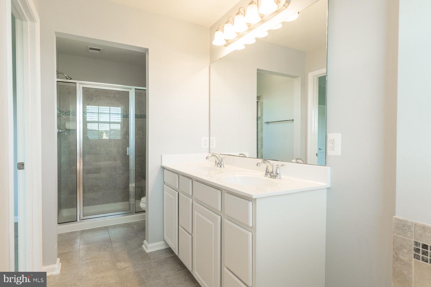 212 Fiesta Drive Stephenson, VA 22656 - Photo 21 of 37 Dual vanities and tiled shower with bench