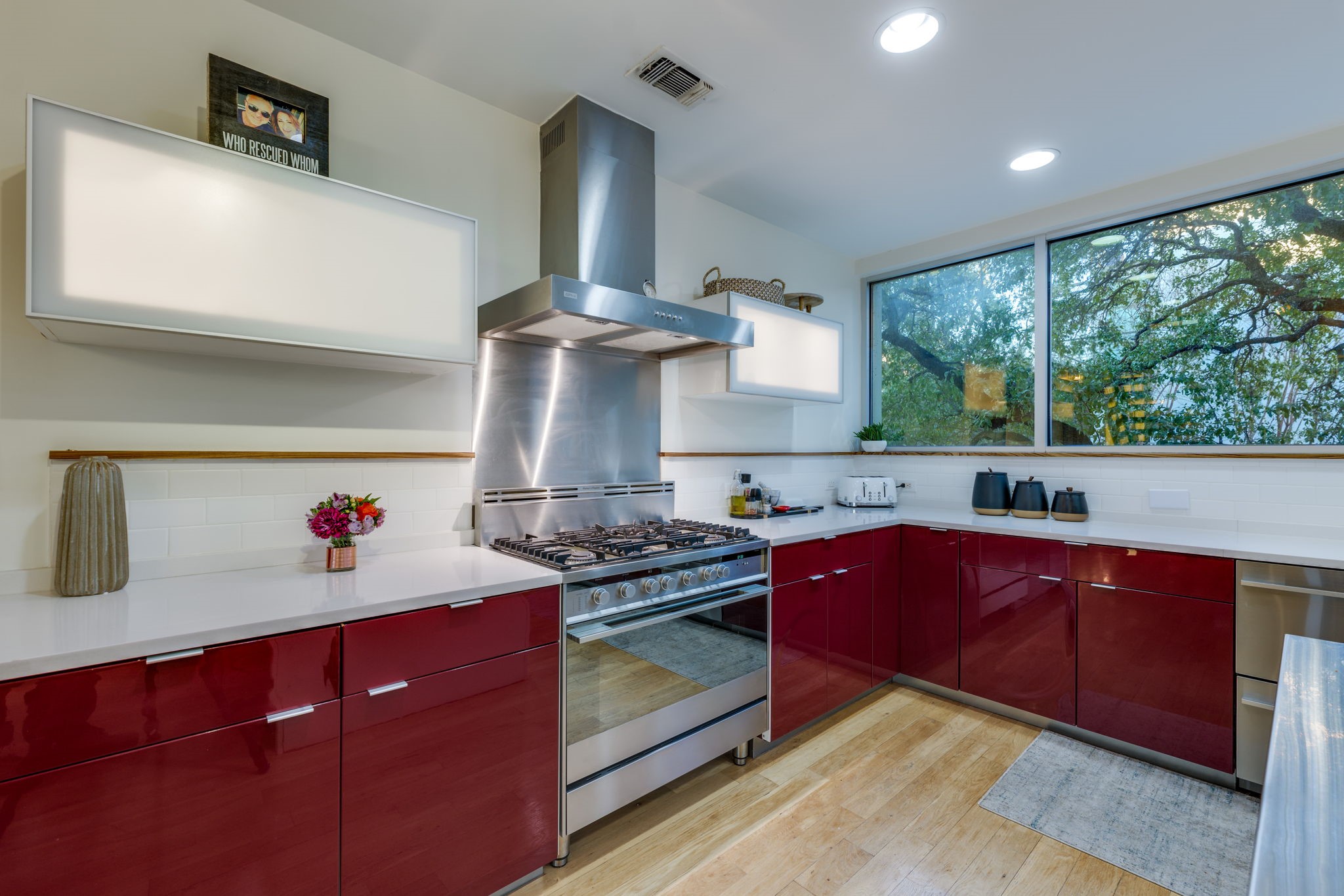 2301 South 5th Street, Unit 5 Austin, TX 78704 - Photo 13 of 40 a kitchen with stainless steel appliances granite countertop a stove and a sink
