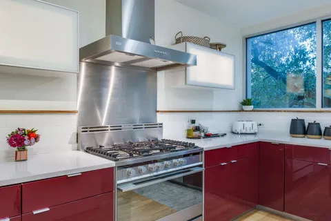 a kitchen with a stove and a refrigerator