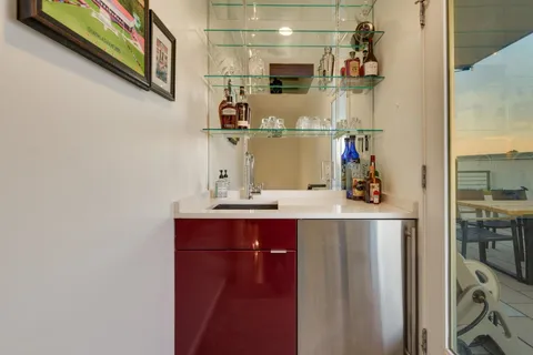 a room with a sink and cabinets