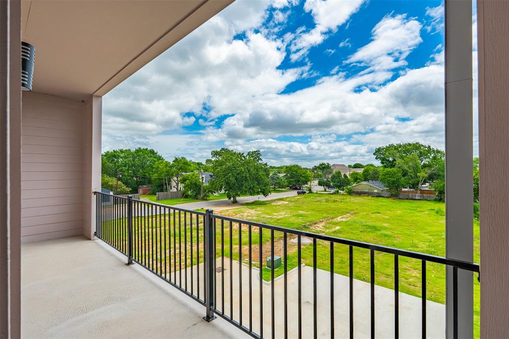 516 South O Connor Road Irving, TX 75060 - Photo 21 of 23 Private balcony featuring concrete flooring and a black metal railing