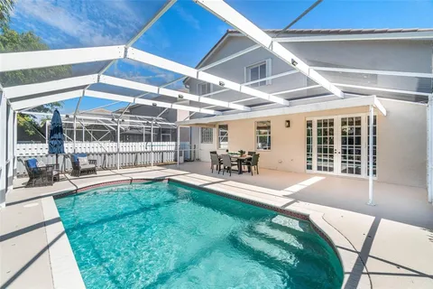 a view of a backyard with sitting area