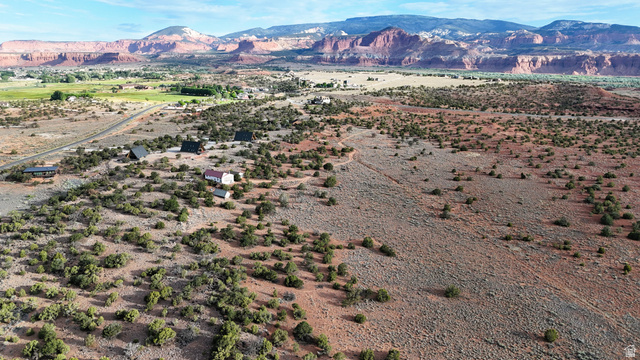 358 South Sky Drive Torrey, UT 84775 - Photo 62 of 82 Expansive desert landscape featuring natural brush, red-hued terrain, and distant mountain ranges