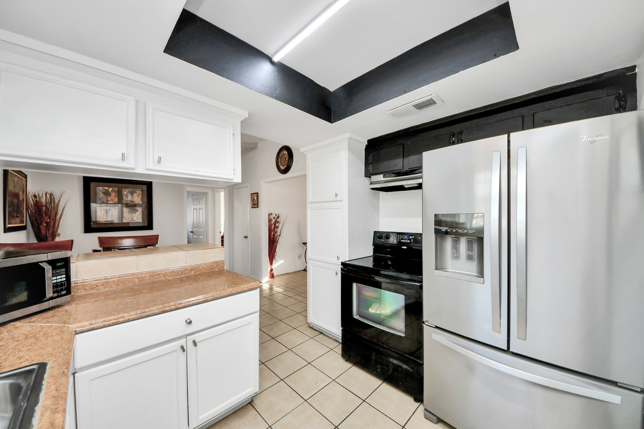 6319 Guadalupe Street Houston, TX 77016 - Photo 14 of 32 a kitchen with stainless steel appliances granite countertop a refrigerator and a sink