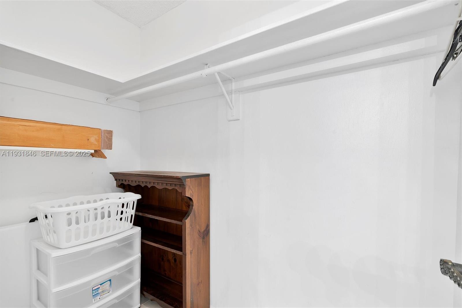 9511 Collins Avenue, Unit 606 Surfside, FL 33154 - Photo 23 of 43 a utility room with dryer and washer