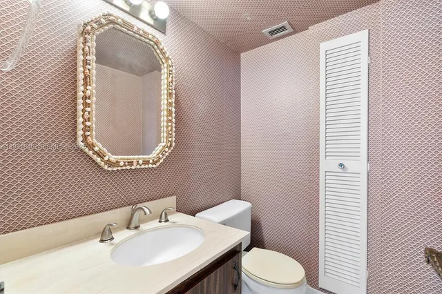 a view of a balcony dining table and chairs