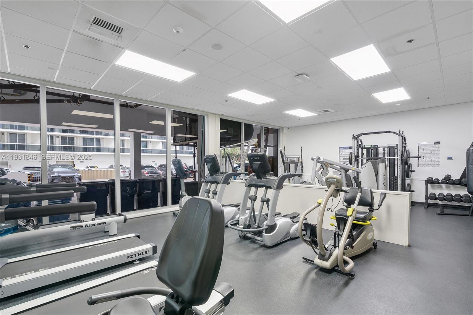 9511 Collins Avenue, Unit 606 Surfside, FL 33154 - Photo 39 of 43 a view of a room with gym equipment