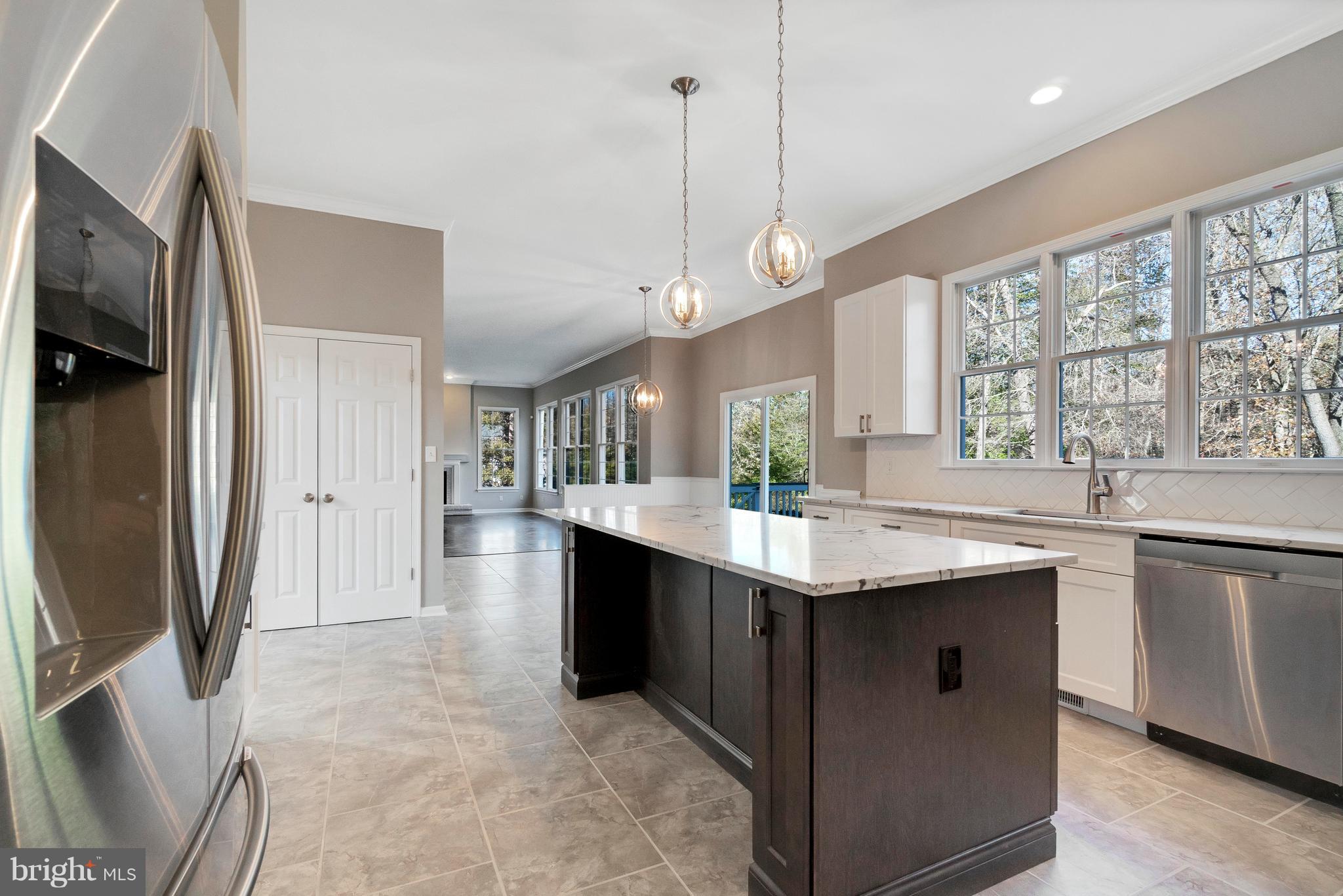 2220 Monkton Road Monkton, MD 21111 - Photo 13 of 45 a kitchen with stainless steel appliances granite countertop a sink and a refrigerator