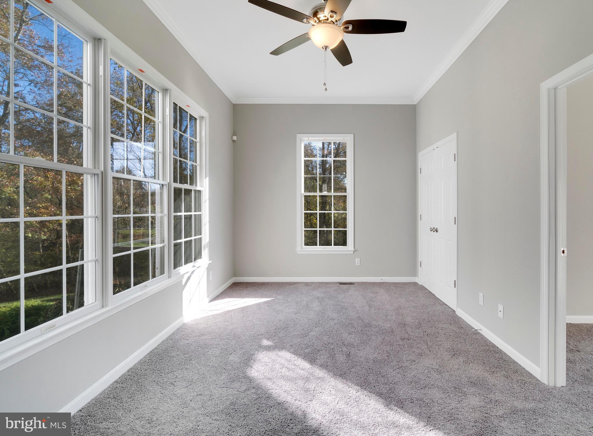 2220 Monkton Road Monkton, MD 21111 - Photo 21 of 45 a view of an empty room with a window and a kitchen