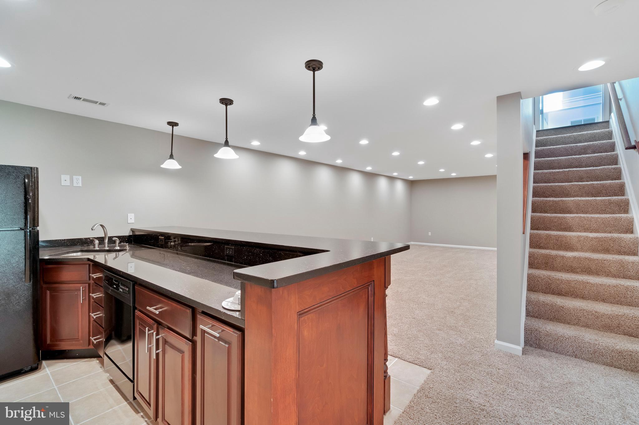 2220 Monkton Road Monkton, MD 21111 - Photo 25 of 45 a kitchen with stainless steel appliances granite countertop a sink a stove and a refrigerator