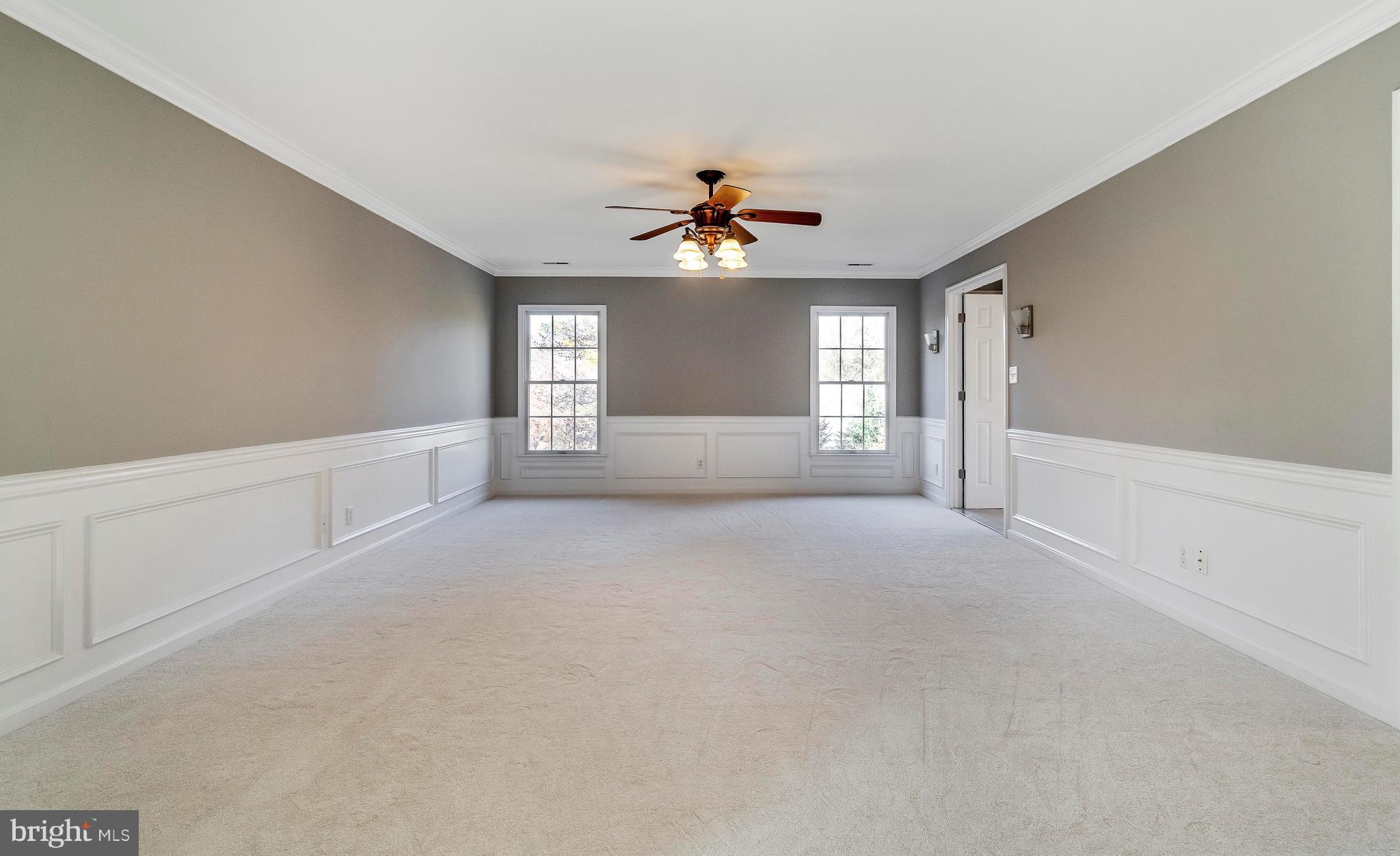 2220 Monkton Road Monkton, MD 21111 - Photo 33 of 45 an empty room with chandelier fan and windows