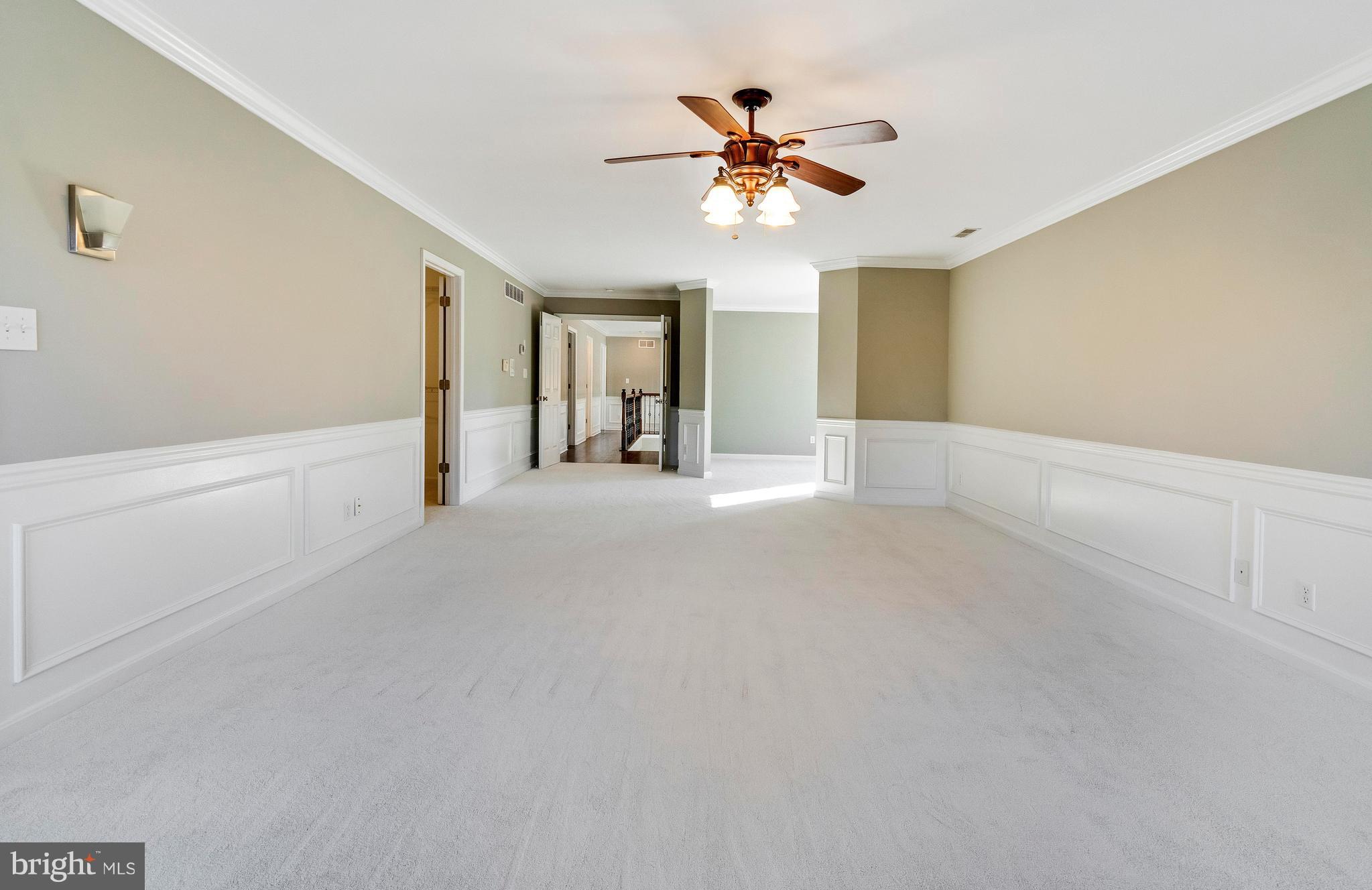 2220 Monkton Road Monkton, MD 21111 - Photo 34 of 45 a view of an empty room with a chandelier fan