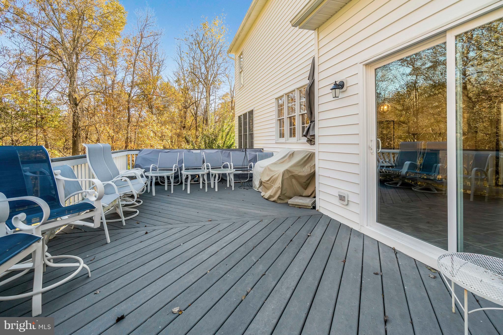 2220 Monkton Road Monkton, MD 21111 - Photo 6 of 45 a view of a patio with table and chairs and wooden floor