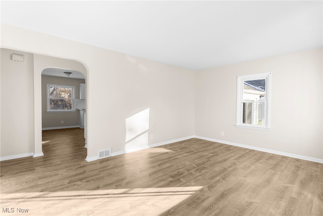 3441 Bell Wick Road Hubbard, OH 44425 - Photo 7 of 22 Unfurnished room featuring wood-type flooring and a wealth of natural light