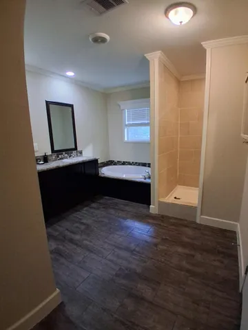 a view of room with wooden floor