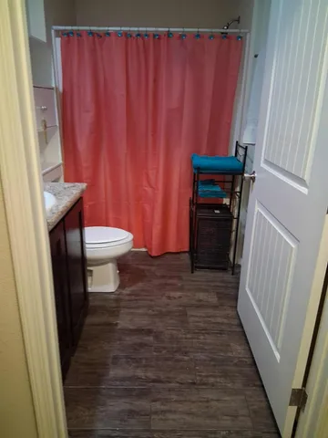 a kitchen with granite countertop a sink and a stove top oven