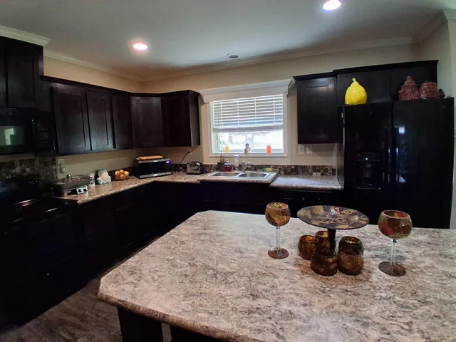 a kitchen with a sink and cabinets