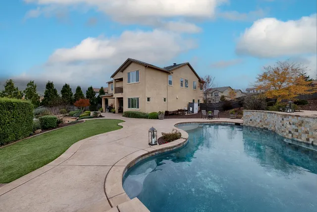 a view of a swimming pool with lounge chair
