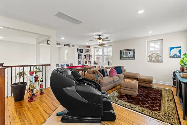 a living room with furniture and a rug