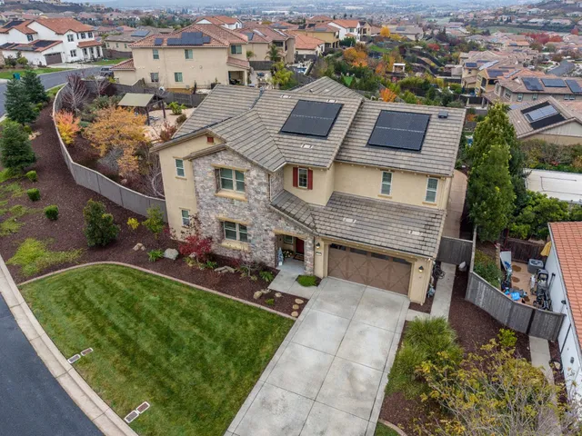 an aerial view of a house with a garden