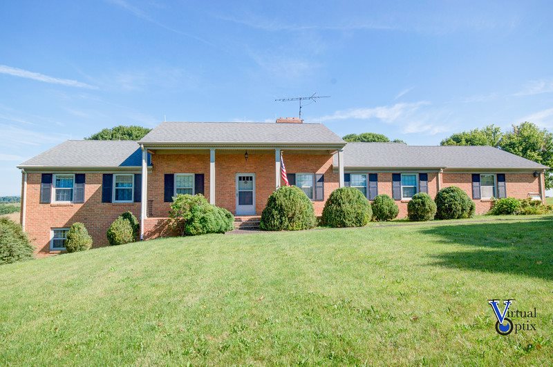 1497 Tinkling Spring Road Staunton, VA 24401 - Photo 1 of 31 a front view of a house with a yard