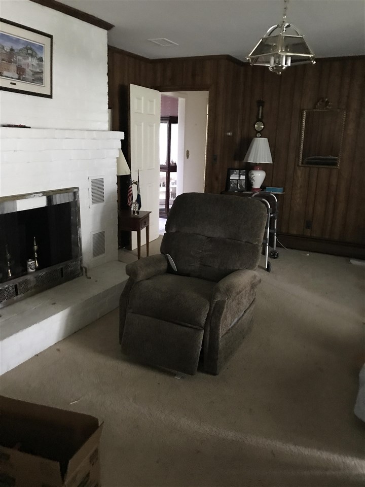 1497 Tinkling Spring Road Staunton, VA 24401 - Photo 16 of 31 a living room with furniture and a fireplace