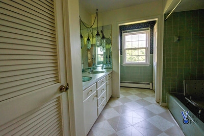 1497 Tinkling Spring Road Staunton, VA 24401 - Photo 19 of 31 a bathroom with a sink a mirror and shower