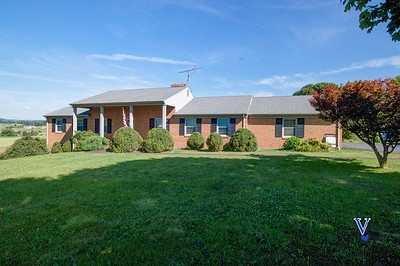 1497 Tinkling Spring Road Staunton, VA 24401 - Photo 2 of 31 a front view of a house with a yard and potted plants