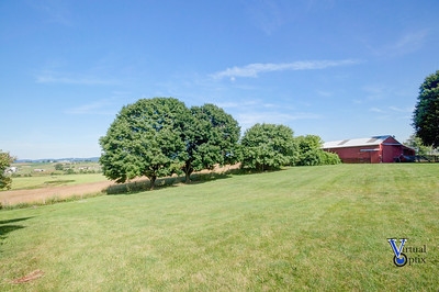 1497 Tinkling Spring Road Staunton, VA 24401 - Photo 28 of 31 a backyard of a house with lots of green space and fog