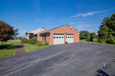 1497 Tinkling Spring Road Staunton, VA 24401 - Photo 5 of 31 a front view of a house with a yard and garage